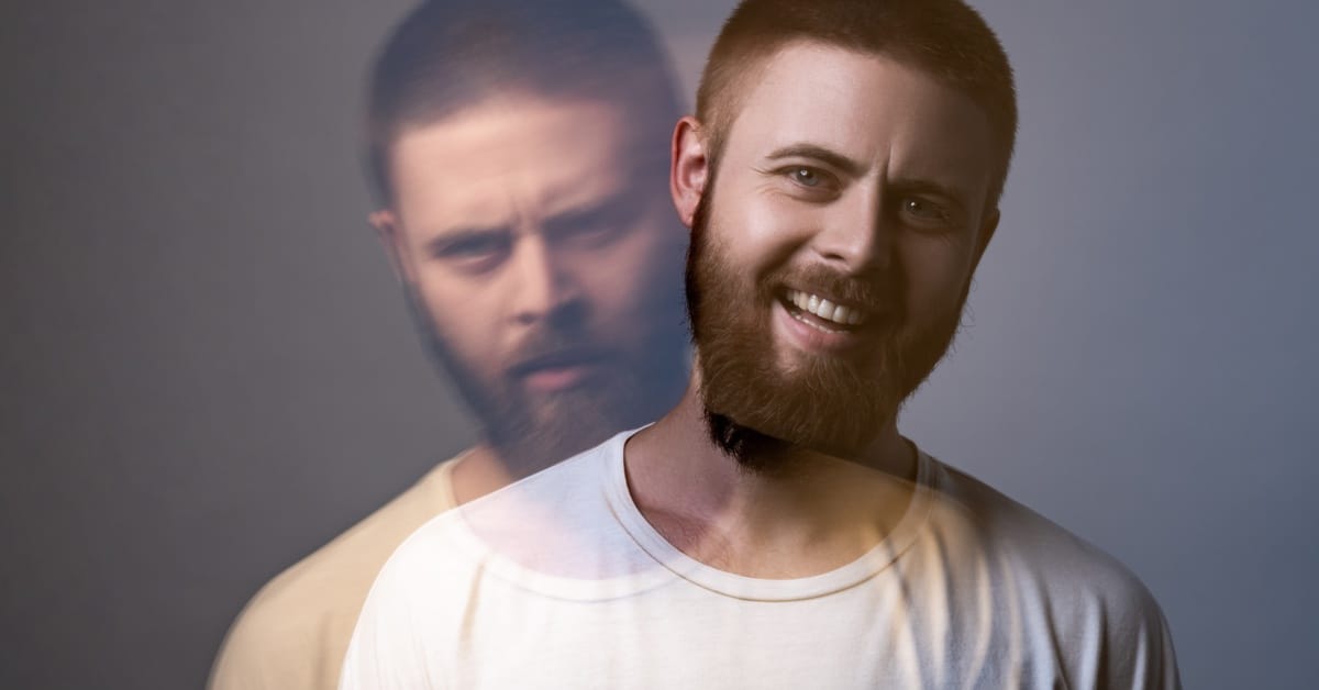 A transparent man wearing a white T-shirt and a happy expression on top of an image of the same man with an upset expression.